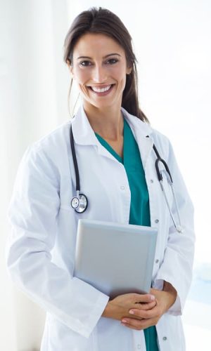 Beautiful young female doctor looking at camera in the office. medical tourism
